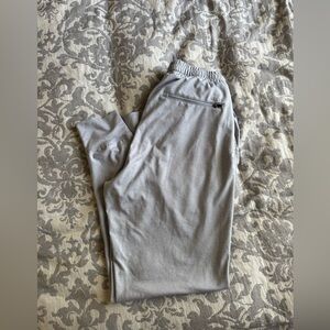 Men's Vuori performance joggers in grey.